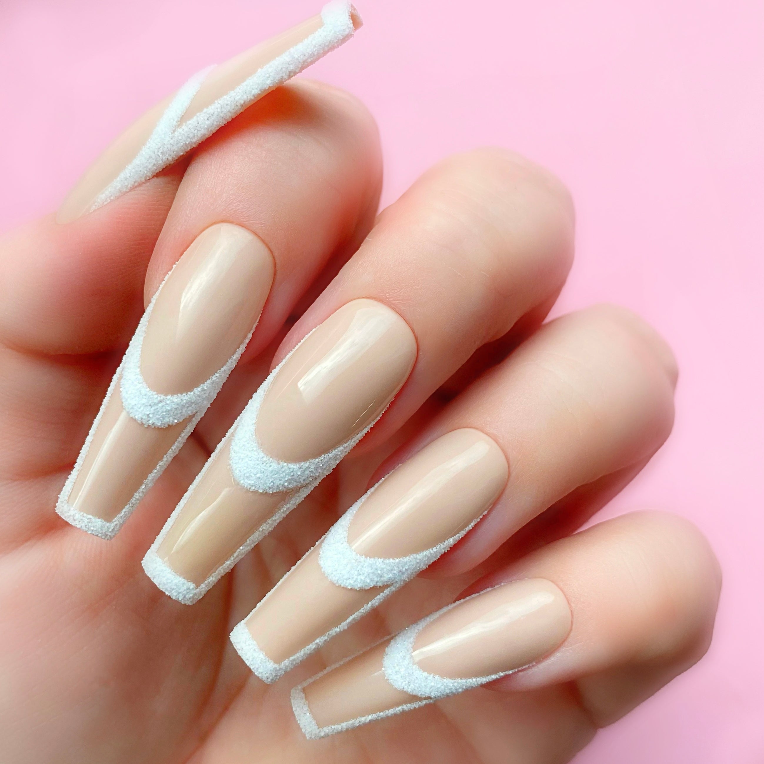 White Canvas gel art applied to nail extensions with custom design